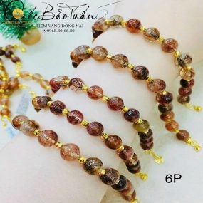 Chuỗi thạch anh nâu mix charm vàng